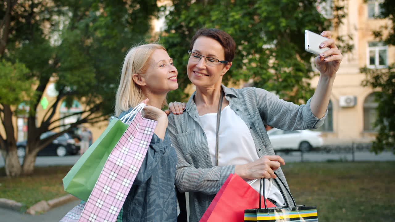 Two women taking a selfie after shopping