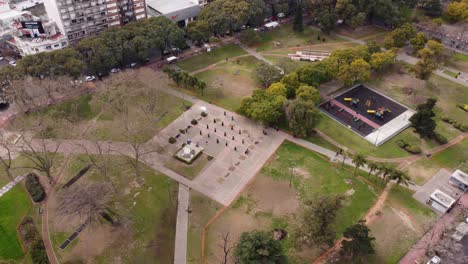 aerial view showing group of ninjas practicing martial arts in green park,4k