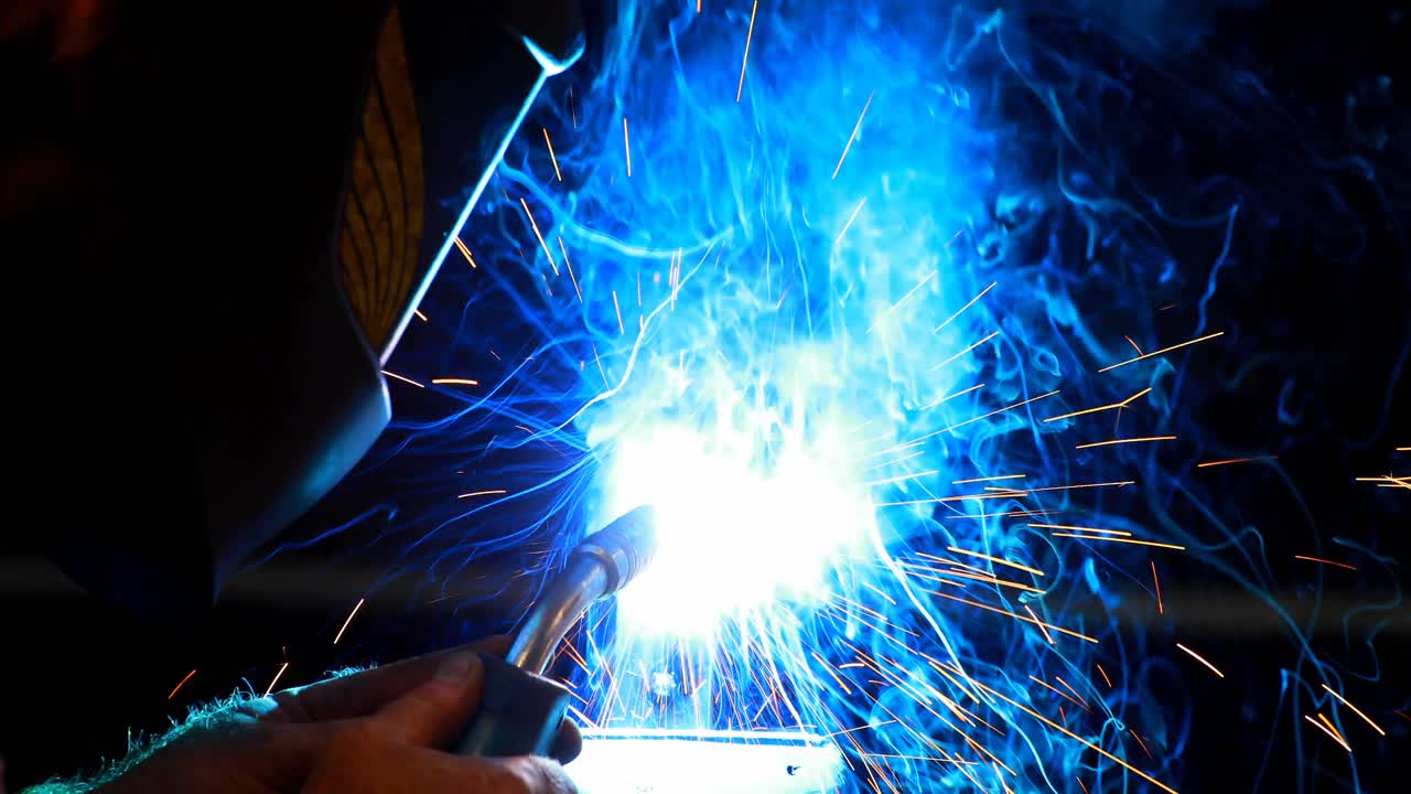 Blacksmith using a welding torch 4k