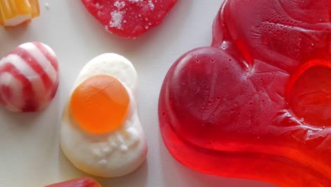 Close-up-upward-movement-about-mixed-jellies-on-a-table-in-studio-enviroment-at-home,-Spain