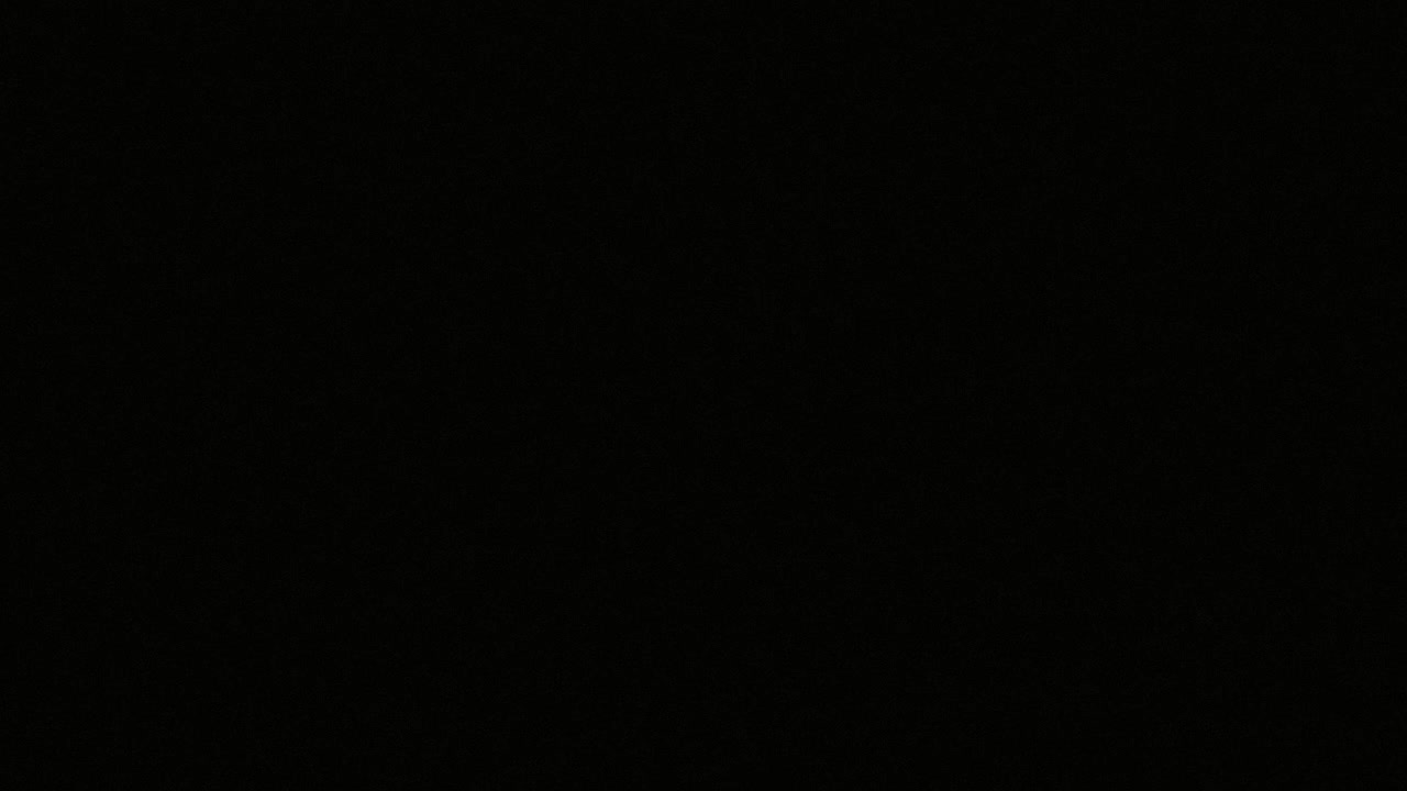 Abstract Glowing Microchip Components and Particles on Black Background