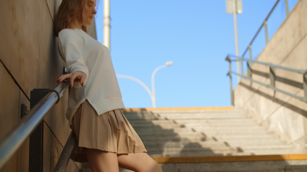 Woman Posing on City Stairs