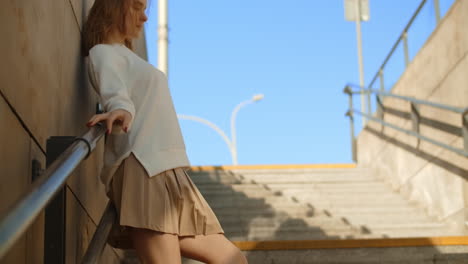 woman posing on city stairs