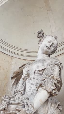 a detailed close-up of a classical female marble statue