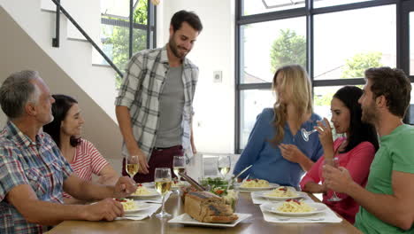 friends interacting while having a meal