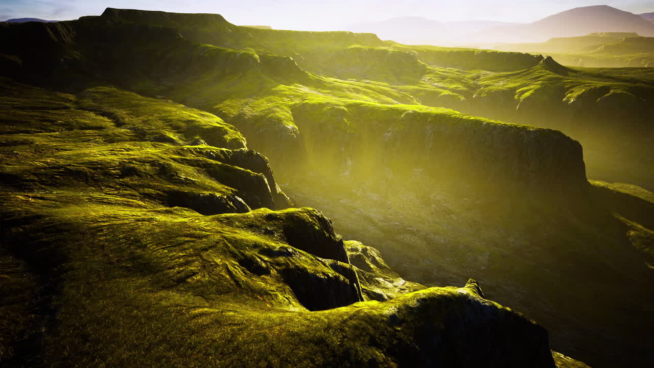 Breathtaking landscape captures sunlight illuminating green hills at dusk