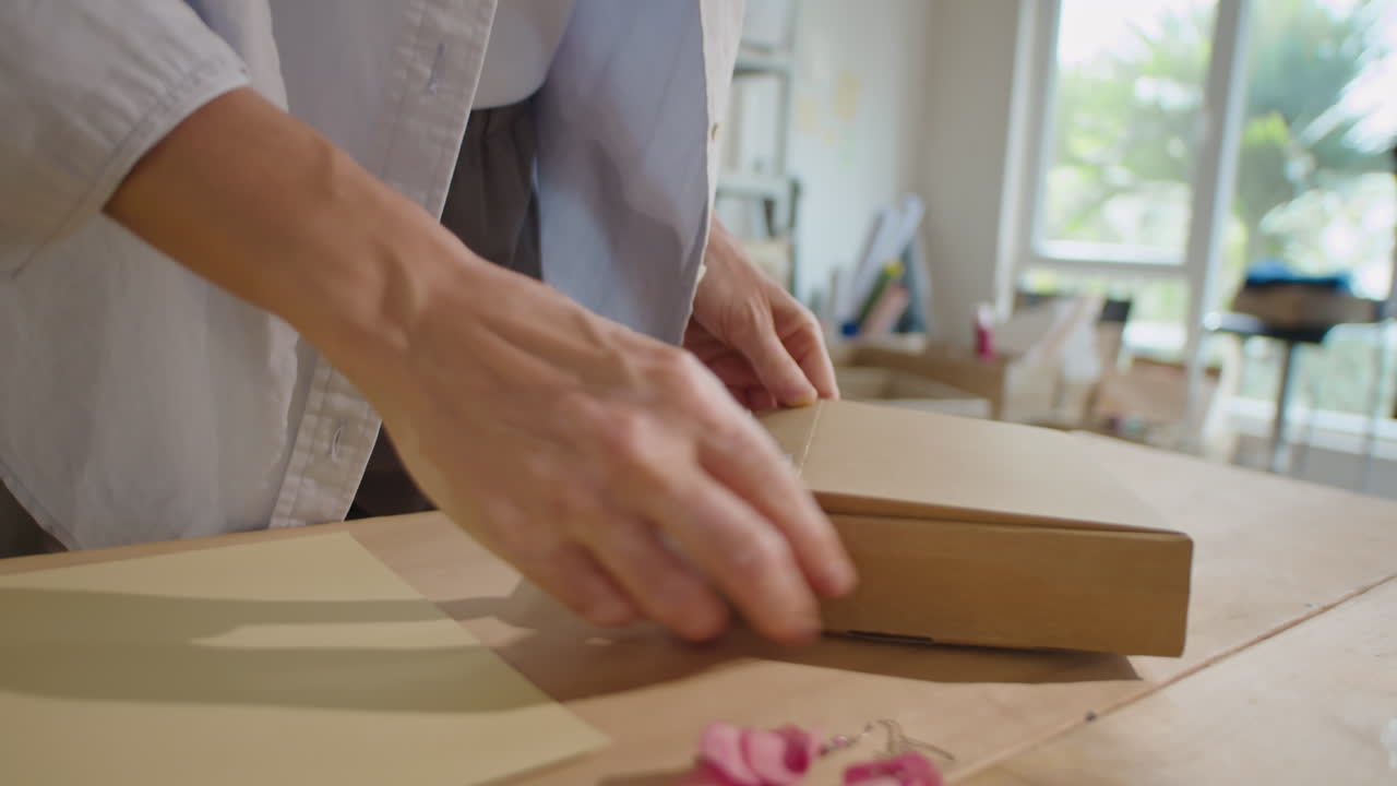 Packing Gemstone Necklace into Box for Shipping to Customer