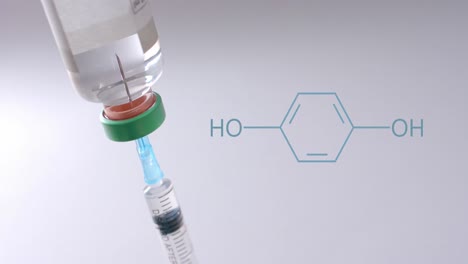 Element-structure-diagram-over-syringe-in-vaccine-vial