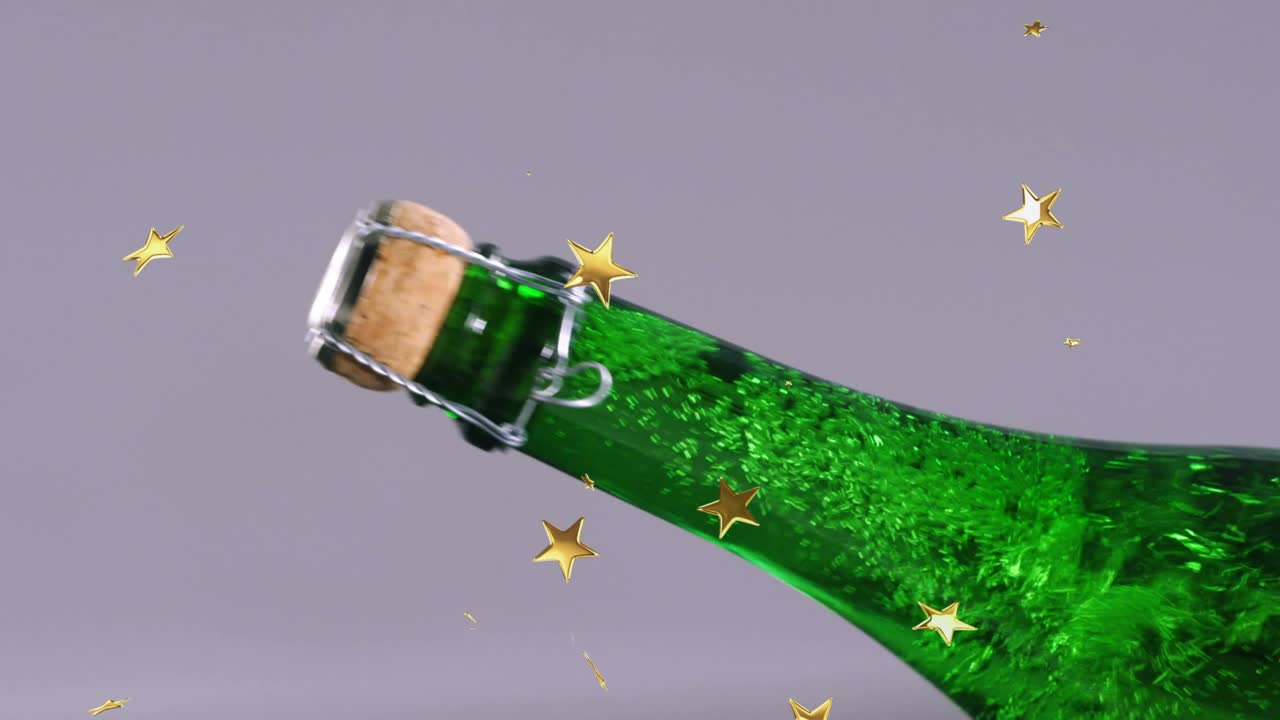 Upon hand entry removing wire cage from bottle neck opening bottle with drifting confetti