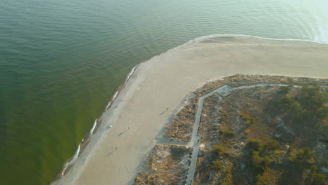 Ascending-aerial-top-down-of-famous-tip-of-Poland-named-Peninsula-Hel-during-bright-sunny-day