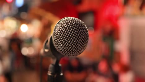 microphone on stage against a background of auditorium.