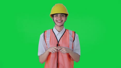 Happy-Indian-female-architect-talking-to-the-workers-Green-screen