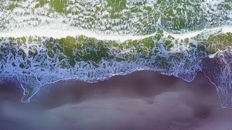 ocean waves drone shot. slowmotion top down view