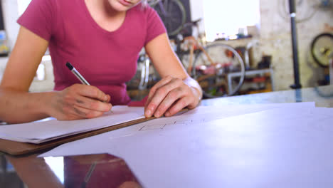 woman drawing a sketch at workshop 4k