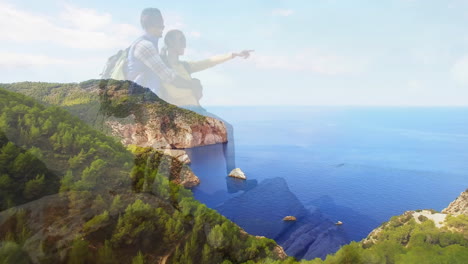 couple hiking rocky coastline, showing animated heart rate graph and health icons