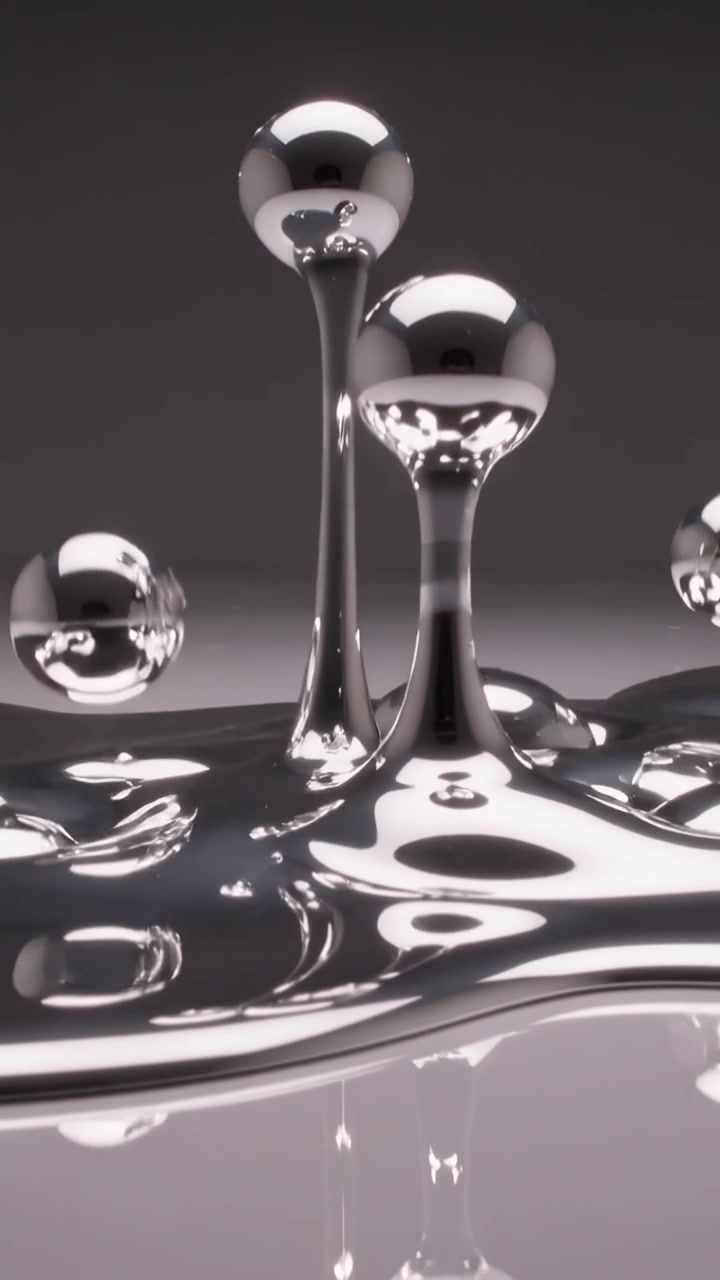 Video verticale: Colonne metalliche che si formano e si innalzano dopo un'ondulazione della superficie in studio, con estremità sferiche.