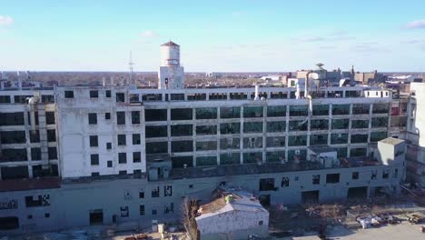 an aerial over the ruined and abandoned packard automobile factory near detroit michigan