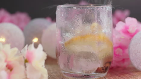 close-up of ice blocks dropping into a refreshing tonic drink