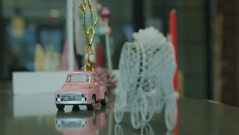 charming pink truck and whimsical wire carriage in a romantic display