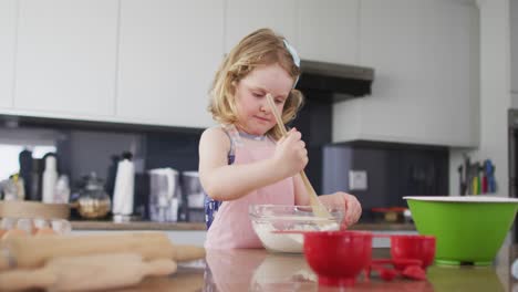 Caucasian-mother-and-daughter-having-fun-cooking-together