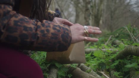 person foraging nettles in the woods