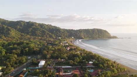 Sunset-over-the-ocean-and-beautiful,-tropical-seaside-town-of-Jaco-on-the-Pacific-Coast-of-Costa-Rica