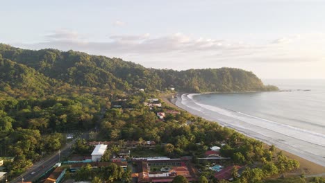 sunset over the ocean and beautiful, tropical seaside town of jaco on the pacific coast of costa rica