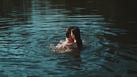 couple kissing in the lake