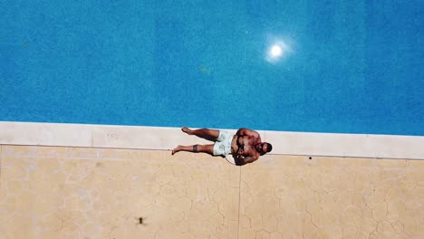 man in the pool overhead view