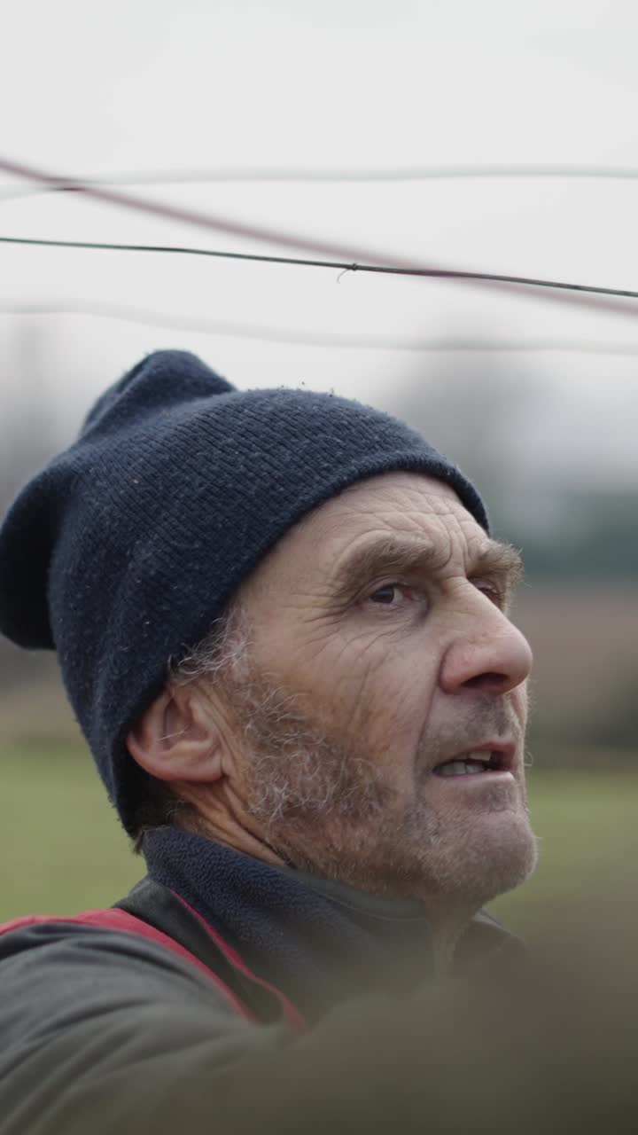 Close-up portrait of a man wearing a beanie outdoors