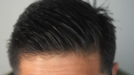 man combing wet hair