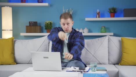 Home-office-worker-man-dances-looking-at-camera.