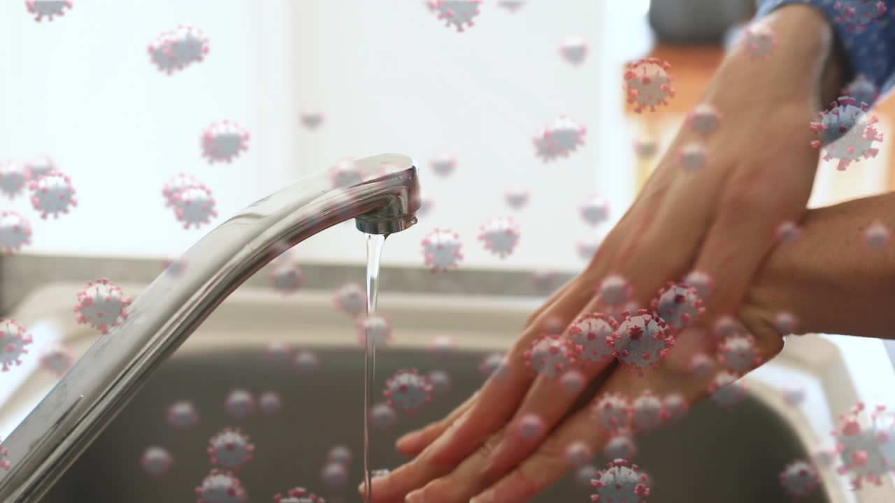 손을  ⁇ 는 사람 위의 코로나 19 세포의 애니메이션