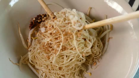 close-up footage of thai styled egg noodles with minced pork cake and pork liver, thailand popular street food