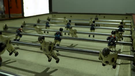 worn table football figures in action