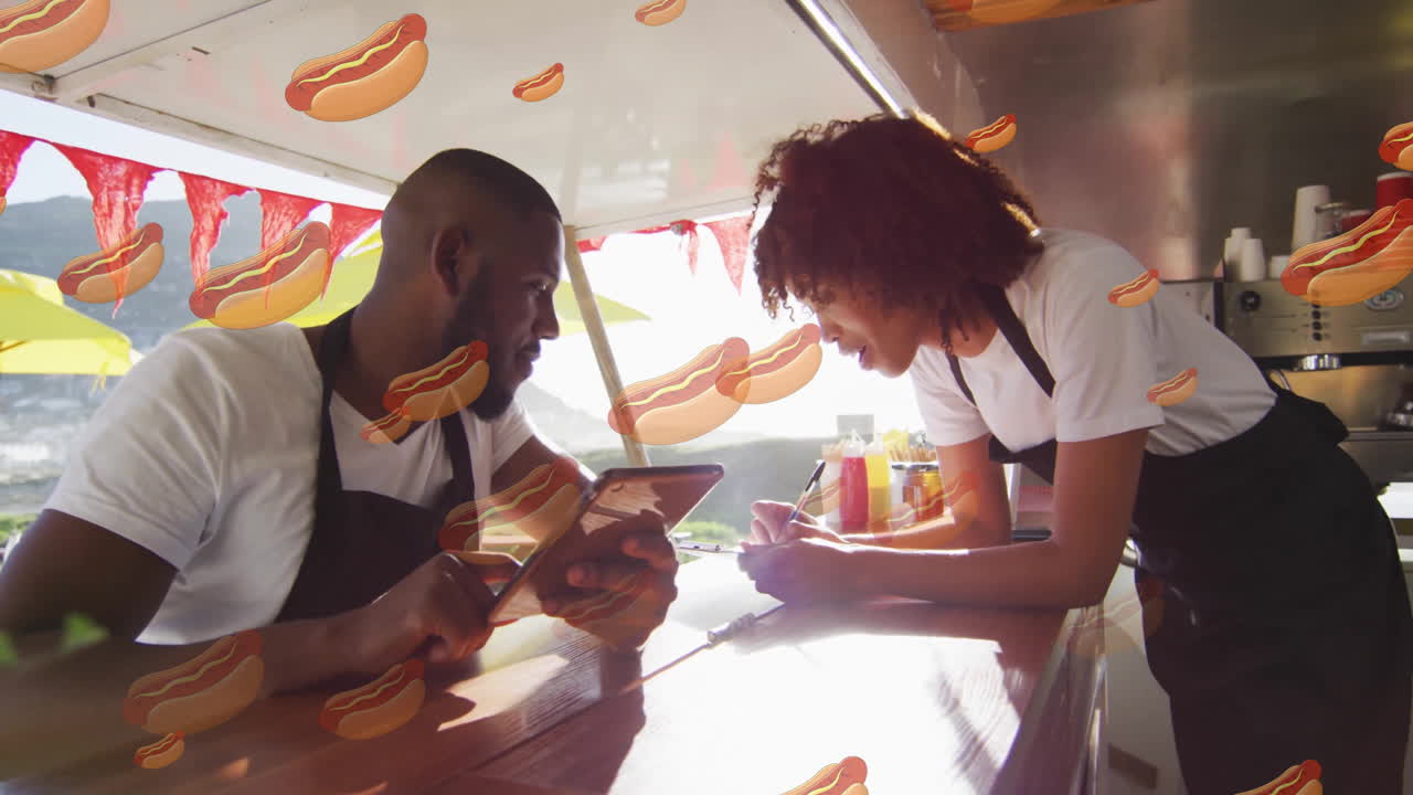 Hot dog animation over two food truck workers discussing orders