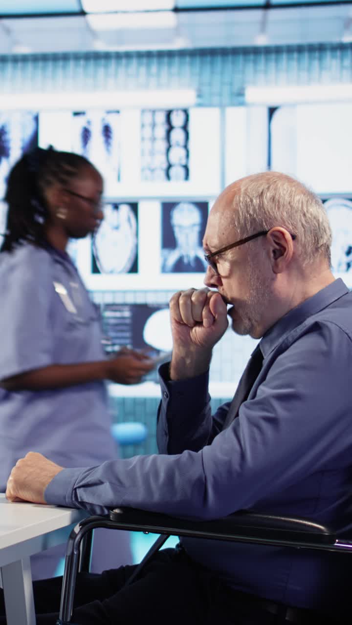 Elderly Man in Wheelchair in Medical Setting