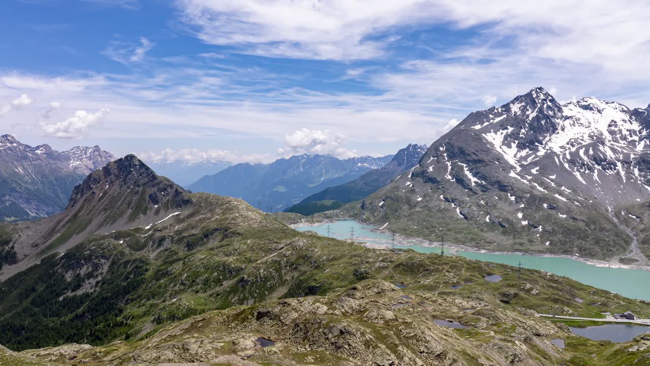 Alpine lake, majestic snow-capped mountains, Bernina Pass, Swiss Alps, Switzerland. Aerial forward, Timelapse, hyperlapse