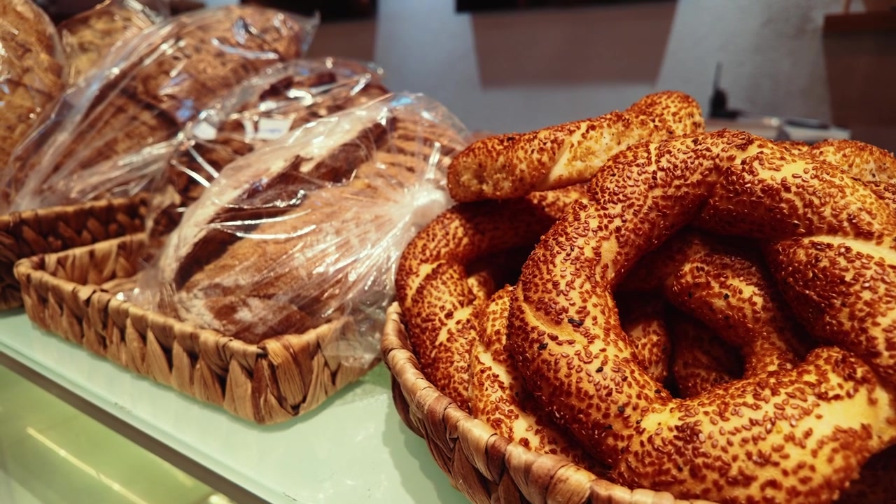 Freshly Baked Simit and Loaves of Bread in a Bakery Display