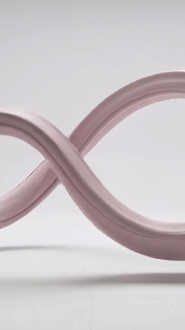 Vertical video: Lifting mauve ribbon form after lift in white studio, looping softly showing volume