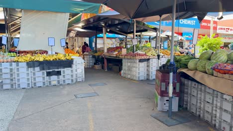 vibrant market with diverse fruits and shoppers