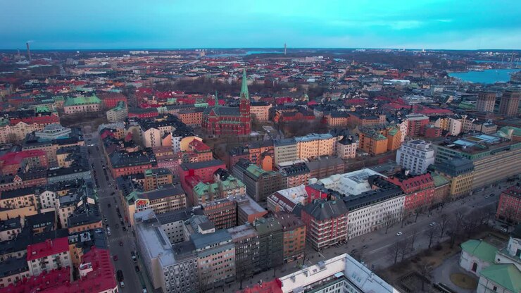 Aerial View of Downtown Stockholm, Sweden at Sunset, Central Vintage Buildings and Streets, High Rise Drone Shot