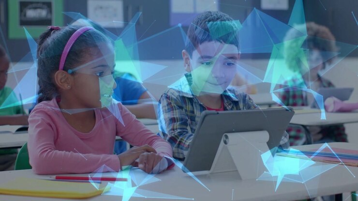 Girl watching as boy tapping tablet in class causing AR overlays over kids highlighting education