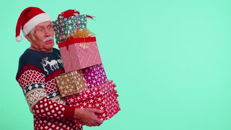 senior grandfather man in christmas sweater holding many gift boxes new year presents shopping sale