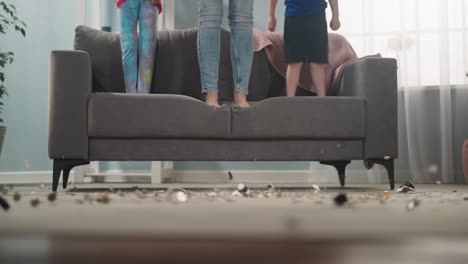 family drops piggy bank to crash and coins scatter on floor