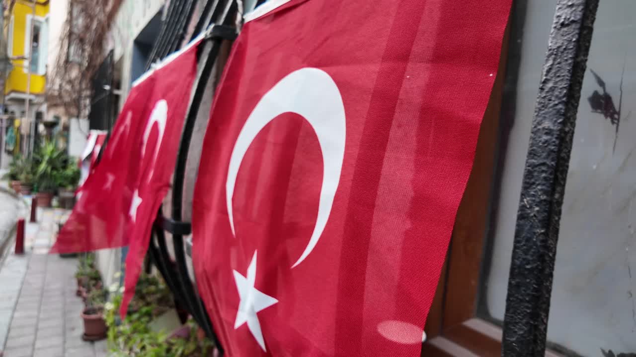 Turkish Flags Hanging on a Fence
