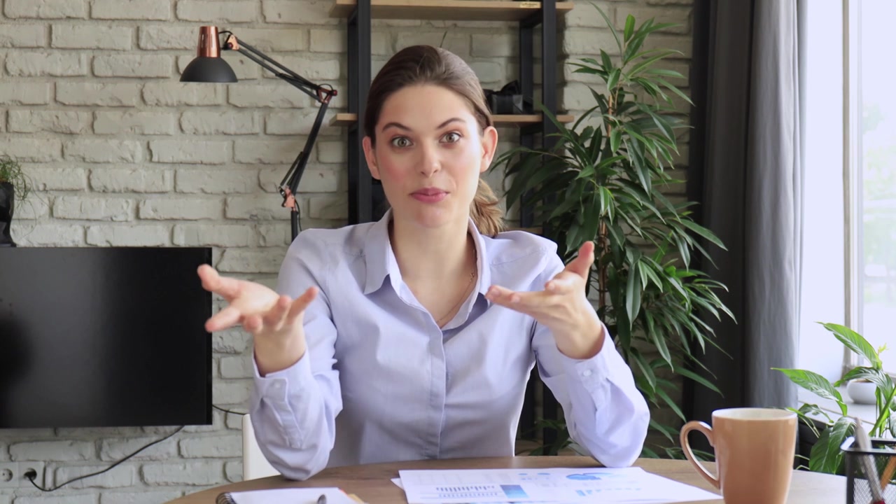 Professional Woman Talking and Gesturing on Video Call