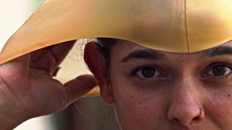 Latina-woman-puts-on-her-swimming-cap-and-prepares-for-a-workout-in-the-pool---slow-motion