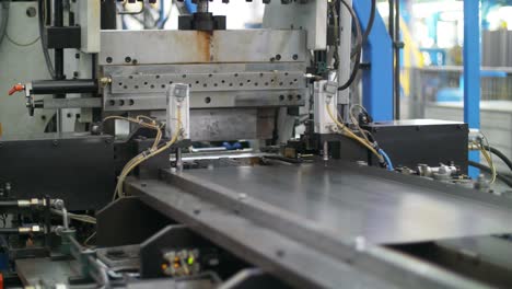 metal sheet forming on metalworking machine. production domestic appliances