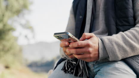 Closeup,-outdoor-and-hands-with-a-smartphone